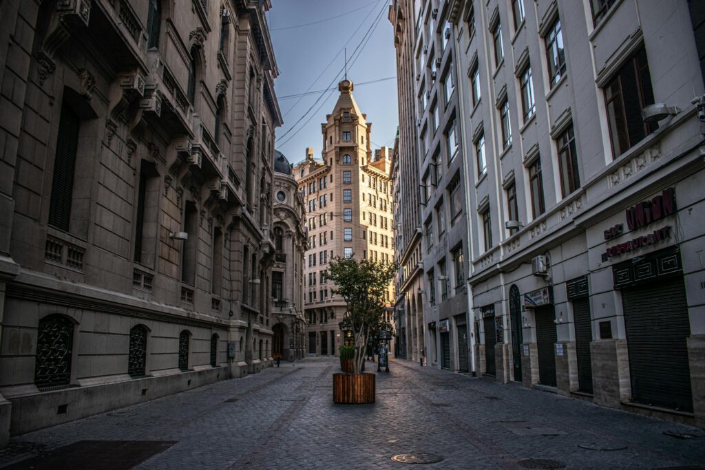 Charming empty street in Santiago, Chile, showcasing classic architecture under a clear sky.